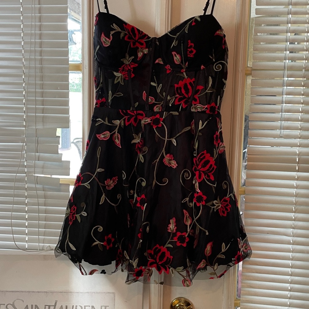 Elegant Black Dress with Red Floral Design